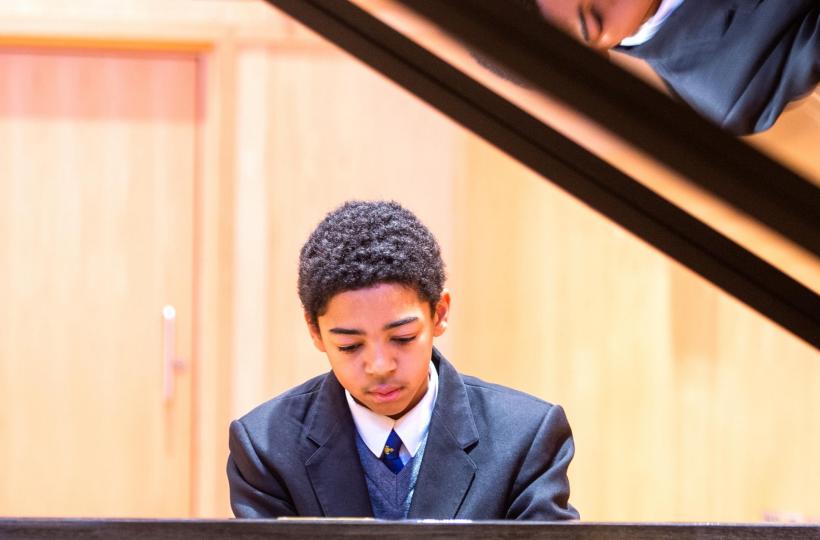 Student playing piano